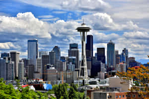 A City Skyline With Clouds Wallpaper