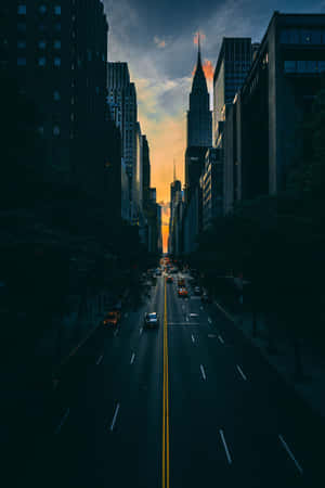 A City Street With Cars Wallpaper