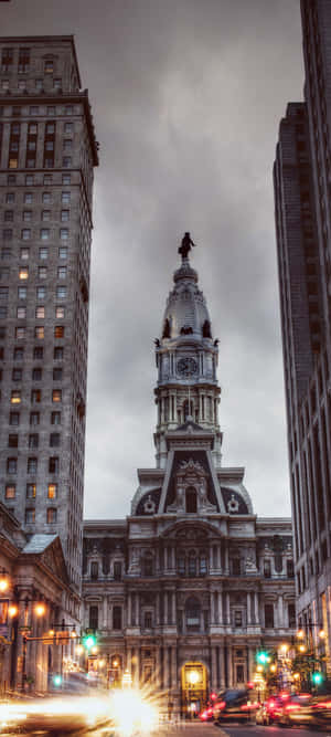 A City With A Clock Tower And Tall Buildings Wallpaper