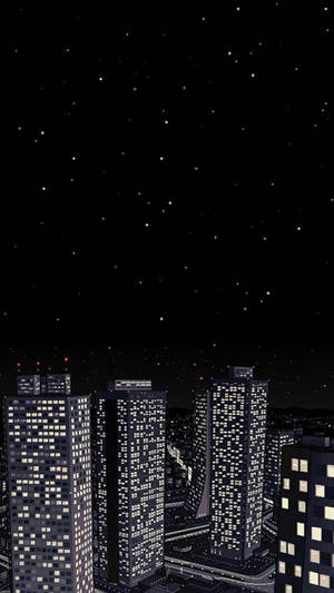 A City With Buildings And A Night Sky Wallpaper