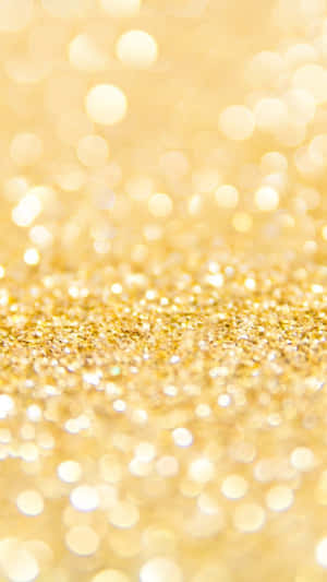 A Close Up Of A Gold Glitter Background Wallpaper