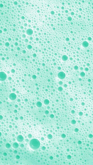 A Close Up Of A Green Bubbles In A Bath Wallpaper