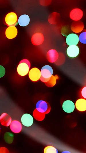 A Close Up Of A Red And Green Christmas Tree Wallpaper