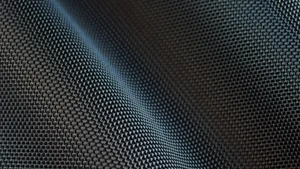 A Close-up Of Wavy Carbon Fiber Wallpaper