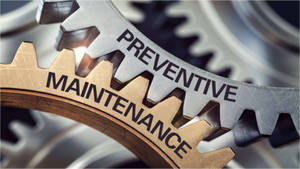 A Close-up Of Working Gears Signifying Preventive Maintenance Wallpaper