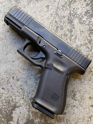 A Close-up View Of A Glock 19 Gen 5 Pistol Wallpaper