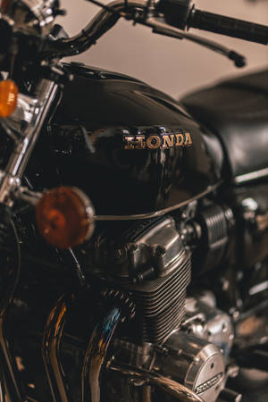 A Closeup Of A Honda Motorcycle Engine Wallpaper