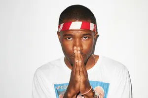 A Closeup Of Artist Frank Ocean Working On His Laptop Wallpaper