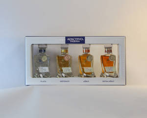 A Collection Of Adictivo Miniature Bottles Wallpaper