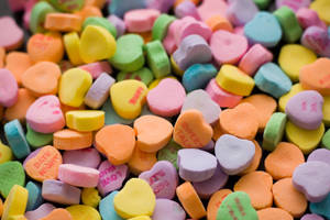 A Colorful Assortment Of Chewy Candy Hearts. Wallpaper