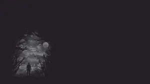 A Dark Forest With A Person Walking Through It Wallpaper