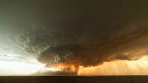 A Deadly Land-spouts Tornado Roaring Through The Vast Plains Wallpaper