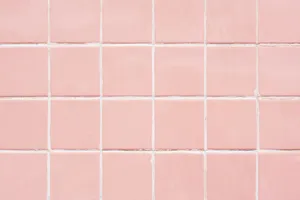 A Delicate, Pastel Pink Laptop Sits Atop A Marble Desktop. Wallpaper