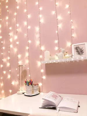 A Desk With A Lamp And Lights Hanging From It Wallpaper