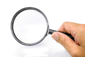 A Detail-oriented Research With Magnifying Glass Wallpaper