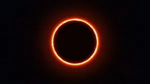 A Double Eclipse In The Dark Blue Sky Wallpaper