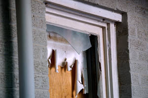 A Dramatic Display Of Sharp Shards On Broken Window Wallpaper