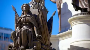 A Female Bronze Statue At The Virginia State Capitol Wallpaper