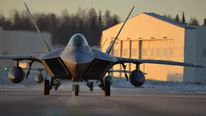 A Fighter Jet Is On The Runway Of A Building Wallpaper