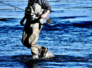 A Fisherman Prepared To Catch The Big One Wallpaper