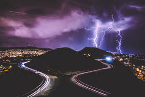 A Flash Of Lightning Strikes The City's Skyline Wallpaper