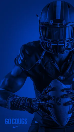 A Football Player Holding A Ball Wallpaper