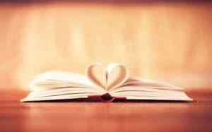 A Gentle Heart Beats Among Pages Wallpaper