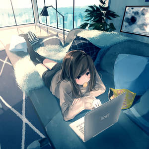 A Girl Is Laying On A Couch With A Laptop Wallpaper