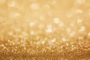 A Golden Glitter Background With Bokeh Wallpaper