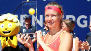 A Grand Victory - Kiki Bertens Proudly Poses With Trophy Wallpaper