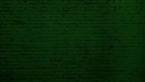 A Green Brick Wall With A White Brick Wall Wallpaper
