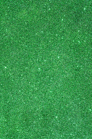 A Green Glitter Background With A Lot Of Sparkles Wallpaper