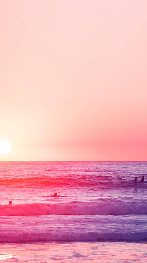 A Group Of People Are Surfing In The Ocean Wallpaper