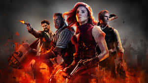 A Group Of People With Guns In Front Of Fire Wallpaper