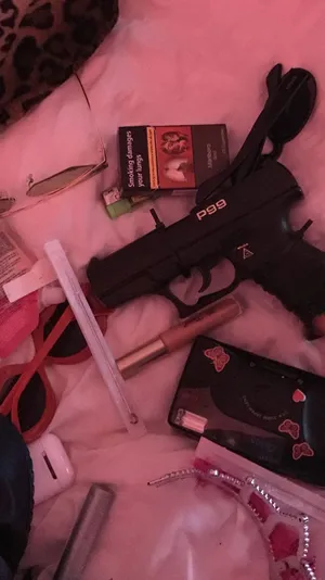 A Gun, A Purse, And A Cell Phone Wallpaper