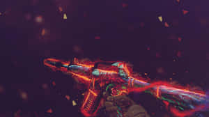 A Gun With A Red Flame On It Wallpaper