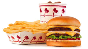 A Hamburger, Fries And A Drink Are Shown Wallpaper