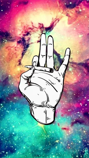 A Hand With A Cigarette In Front Of A Galaxy Wallpaper