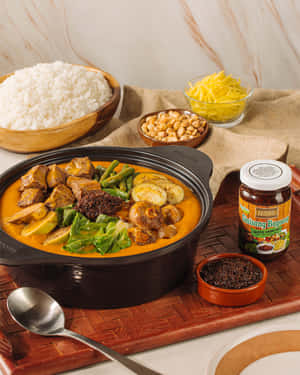 A Hearty Serving Of Traditional Kare-kare With Rice Wallpaper