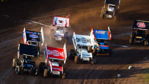 A High-powered Sprint Car Racing Around The Bend. Wallpaper