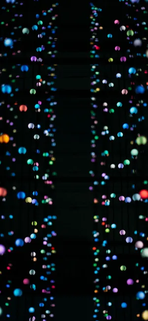 A High Tech Looking Iphone X Oled Sits Against A Black Background. Wallpaper