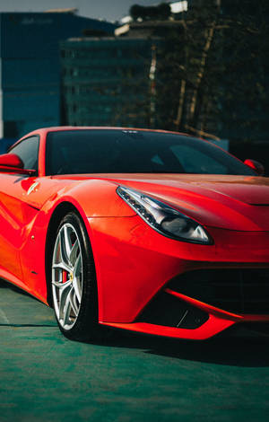 A Lamborghini Car Displaying The Latest 4k Iphone Device Wallpaper