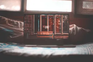 A Laptop On A Bed Wallpaper