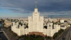 A Large Building With A Clock Tower In The Middle Wallpaper