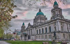 A Large Building With Green Domes Wallpaper