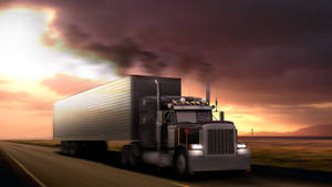 A Large Truck Driving Down A Road Wallpaper