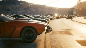 A Line Of Cars Parked On A Road Wallpaper