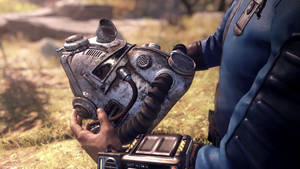 A Lone Helmet Abandoned Amidst Destruction In Fallout 76 Wallpaper