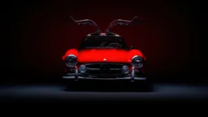 A Magnificent Mercedes Benz Car Is Glistening In The Sun. Wallpaper