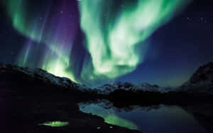 A Majestic Display Of The Aurora Borealis Wallpaper